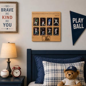 May include: A square wooden display board featuring eight baseball trading cards arranged in two rows. The board includes the quote "Never let the fear of striking out keep you from playing the game" by Babe Ruth and a baseball player silhouette logo.