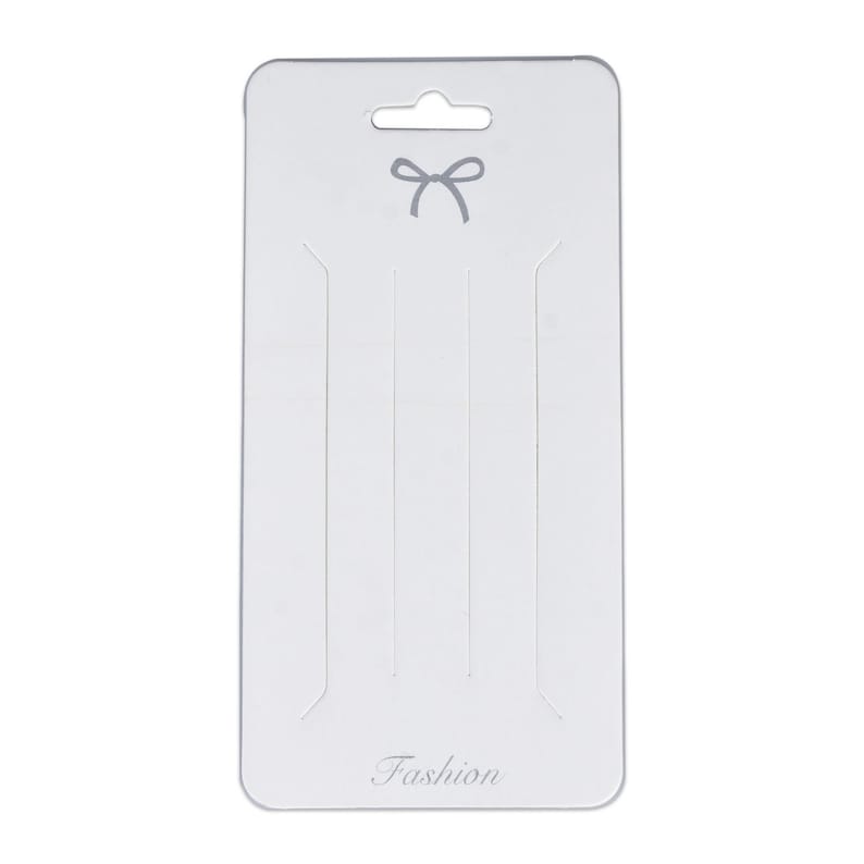 May include: White cardboard packaging with a hanging hole at the top and a gray bow design. The packaging has the word "Fashion" printed at the bottom.