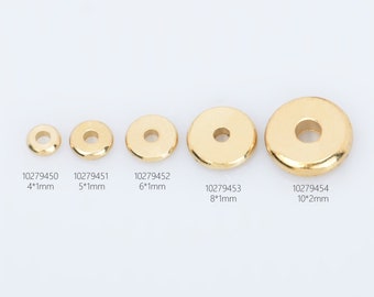 Könnte beinhalten: Fünf goldfarbene Metallringe in verschiedenen Größen. Die Ringe sind flach und haben ein Loch in der Mitte. Die Ringe sind mit ihrer Größe in Millimetern beschriftet: 4*1mm, 5*1mm, 6*1mm, 8*1mm, 10*2mm.