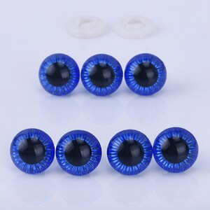 May include: Six blue plastic safety eyes with black pupils and a silver shimmer. The eyes are perfect for crafting projects like stuffed animals.