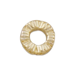 May include: Gold-toned metal bead with a textured, ridged design. The bead has a circular shape with a hole in the center.