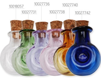 May include: Set of seven small glass bottles with cork stoppers. The bottles are clear, green, lavender, pink, amber, and blue. Each bottle has a unique swirl design.