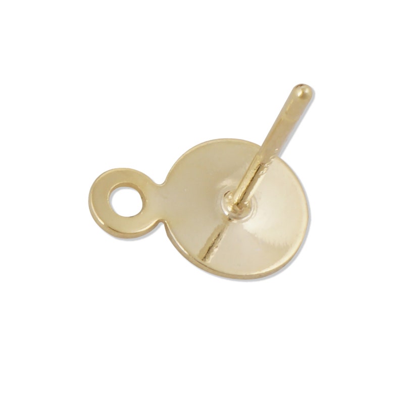 May include: Gold-toned earring finding with a round post and a small loop. The finding is designed to be attached to a charm or pendant.