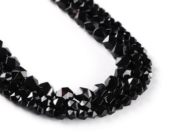 May include: A black gemstone necklace made of faceted beads. The beads are arranged in a multi-strand design, creating a layered look.