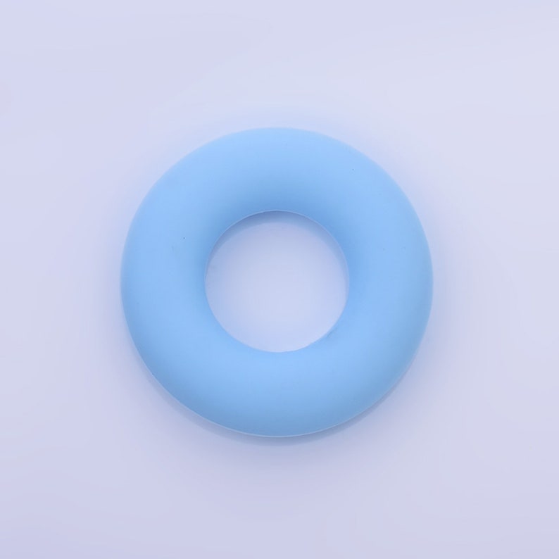 May include: A light blue rubber ring, also known as a stress ball or a finger ring, is a simple and effective tool for relieving stress and improving hand strength.