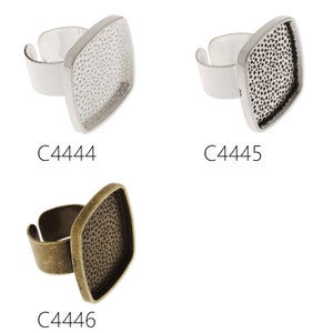 May include: Three silver and bronze ring blanks with square bezels. The bezels have a textured surface. The ring blanks are labeled C4444, C4445, and C4446.