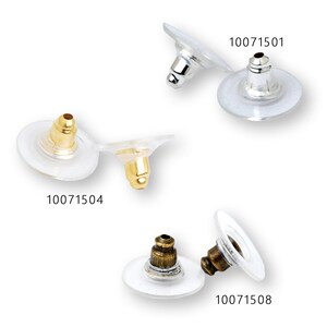 May include: Three pairs of earring backs, each with a different colored post. The earring backs are clear plastic with a round base and a small post. The posts are gold, silver, and bronze. The product numbers are 10071501, 10071504, and 10071508.