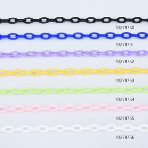 May include: A set of seven plastic chains in different colours: black, blue, purple, yellow, green, pink, and white. Each chain is approximately 10 inches long and has a classic oval link design.