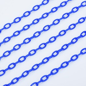 May include: Multiple strands of bright blue plastic chain. The chain is made of oval links.