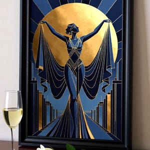 a framed artwork depicting a stylized female figure with outstretched arms, set against a backdrop of a large golden sun. The artwork is displayed on a wooden surface, with a glass of wine and a rose placed nearby.