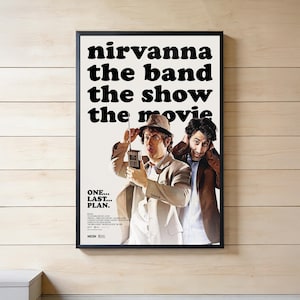 May include: A framed movie poster with the title "nirvanna the band the show the movie" in large black text. The poster features two men, one holding a walkie-talkie. The text "ONE... LAST... PLAN." is also visible.