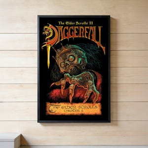 May include: A framed poster featuring The Elder Scrolls II Daggerfall artwork. The image displays a skeletal figure wearing a crown, with a clawed hand reaching forward. The text reads The Elder Scrolls II Daggerfall and The Elder Scrolls Chapter 2.