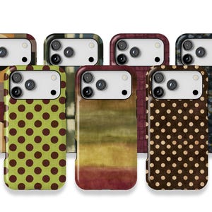 May include: A collection of seven smartphone cases arranged in two rows, featuring various patterns including lime green with brown polka dots, brown with cream polka dots, horizontal colour gradients, geometric blocks, and dark textured surfaces.