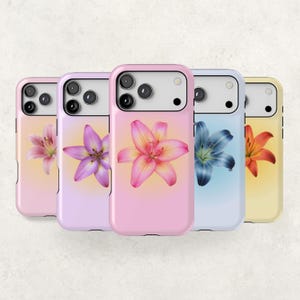 May include: Five smartphone cases arranged in a row, each featuring a distinct lily flower graphic centered on a soft gradient background. The cases display a variety of colors including light pink, lavender, bright pink, light blue, and pale yellow.