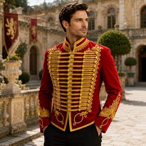 May include: A vibrant red military-style jacket featuring an upright collar and elaborate gold braided cord detailing across the front. The sleeves and chest are adorned with intricate gold embroidery, creating a structured and formal appearance.