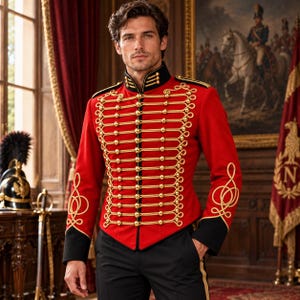 May include: A vibrant red military-style jacket featuring black collar and cuffs, adorned with intricate gold braided cord detailing and rows of polished gold buttons across the front, paired with solid black trousers with a gold side stripe.
