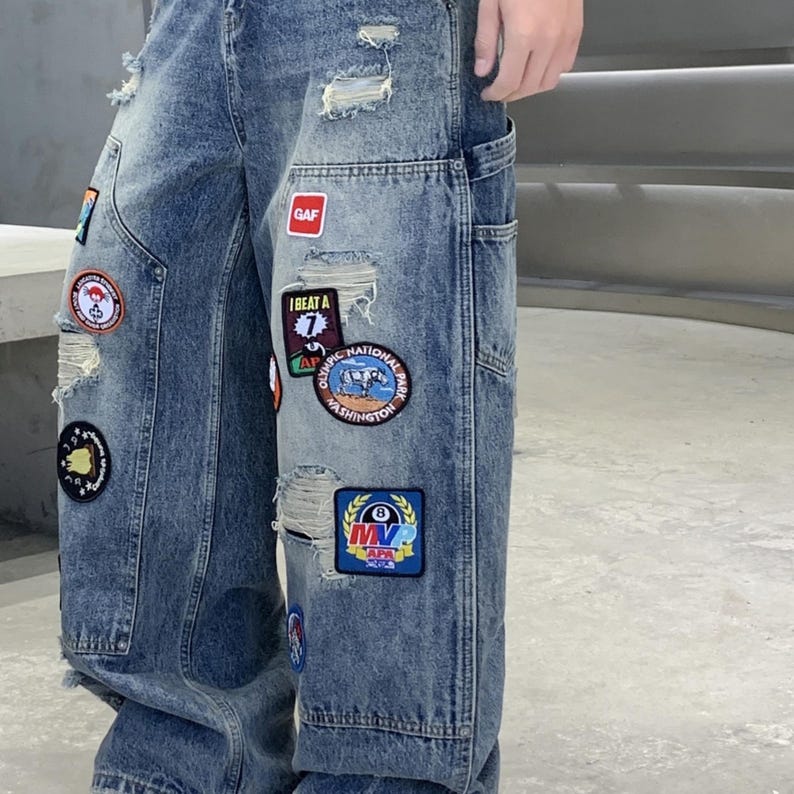 Embroidered Ripped Jeans | Denim Wide Leg Pants | Daily Wear | Retro Casual Streetwear

Distressed wide leg denim pants with embroidered patches, ripped details, and retro streetwear style.