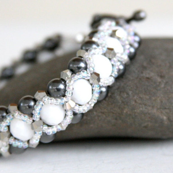 White Czech glass beaded bracelet with gray Swarovski glass pearls, crystals, Japanese seed beads, and a gunmetal toggle