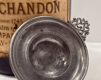 Vintage French Pewter Tastevin (wine tasting cup) with decorative handle.