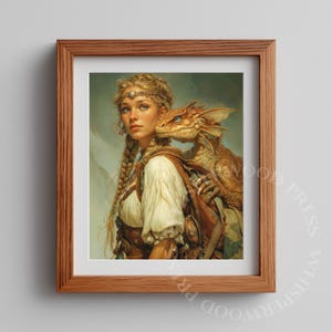 May include: A framed print featuring a young woman with blonde braids and a small dragon. The woman wears a white blouse, brown vest, and a silver headband. The dragon is brown with blue eyes, perched on her shoulder.