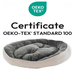May include: A plush, oval pet bed with a gray interior and a cream-colored corduroy exterior. The bed is labeled with the text "Certificate OEKO-TEX&reg; STANDARD 100" and the OEKO-TEX logo, indicating it meets specific safety standards.