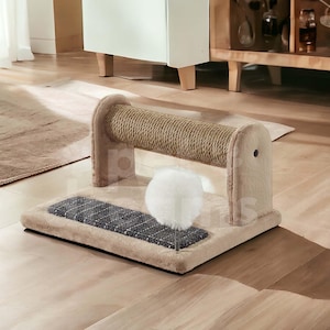 May include: A beige cat scratching post with a sisal rope scratching barrel and a fluffy white ball toy. The base has a dark grey textured pad. The post is designed for indoor use and is made of soft, plush materials.