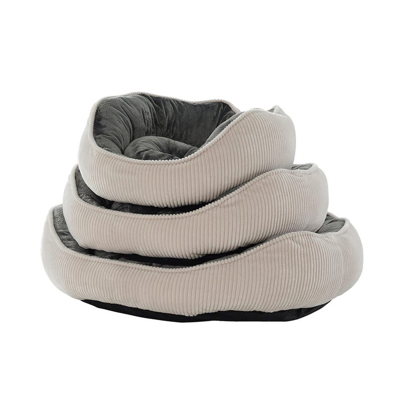 May include: Three beige corduroy pet beds stacked on top of each other. The beds have a soft, gray interior and a black base. The beds are round and have a raised edge.