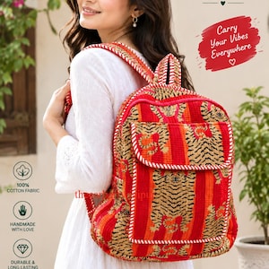 May include: A quilted fabric backpack featuring a vibrant tiger print in shades of orange, red, and black. The bag includes a front pocket with a flap, adjustable shoulder straps, and white stitched detailing. Text on the bag reads Thearberry Jaipur.