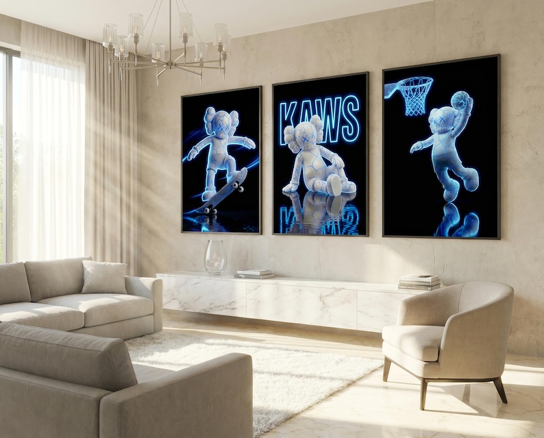 May include: Three framed art prints featuring a blue-toned KAWS character in different poses against a black background. One print shows the character skateboarding, another sitting, and the last one dunking a basketball. The word "KAWS" is in blue neon.