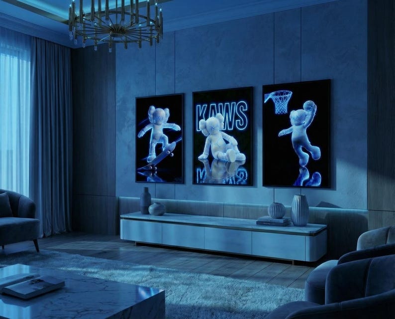 May include: Three framed artworks featuring a neon-style KAWS character in various poses: skateboarding, seated, and playing basketball. The artworks are displayed in a modern living room with blue lighting, a low cabinet, and a chandelier.