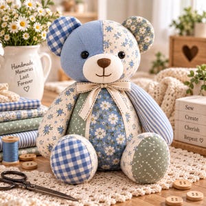 May include: A patchwork teddy bear crafted from various fabrics featuring blue and white gingham, floral patterns, and striped designs. The bear has a cream-colored muzzle, a brown stitched nose, black eyes, and a cream ribbon tied around its neck.