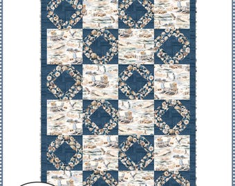 May include: A quilt pattern titled "Shoreline" by Fabric Café. The quilt features a beach scene with seashells and beach chairs, set within a blue grid. The finished quilt measures 39" x 57". The pattern requires 3 yards of fabric.