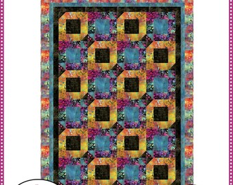 May include: A Fabric Café quilt pattern titled Velocity featuring a colorful geometric design with black, blue, purple, and orange patterned fabric blocks. The pattern includes the text Make it with 5 yards and 57 inches by 79 inches.