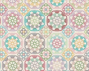 May include: A fabric print featuring a repeating pattern of multicolored circular and diamond-shaped motifs on a cream background. The design includes teal, red, yellow, pink, and purple lines. A 12-inch ruler is visible along the bottom edge.
