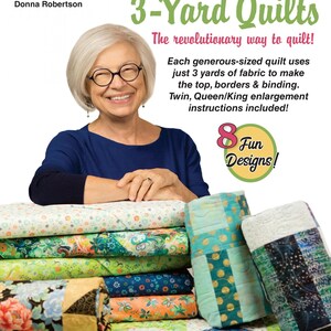 May include: A woman smiles while holding stacks of colorful fabric for quilting. The book cover reads "Quick'n Easy 3-Yard Quilts" and "The revolutionary way to quilt!" with the text "8 Fun Designs!" below.