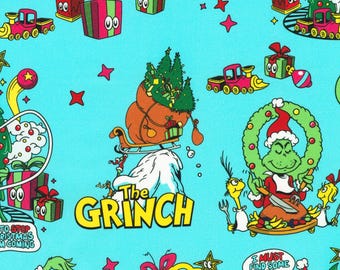May include: A light blue fabric featuring a repeating pattern of The Grinch characters, red and green gift boxes, yellow trains, and Christmas trees. The text "The Grinch" appears in yellow, along with speech bubbles containing "I must find some way".
