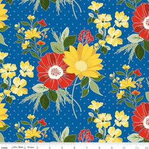 May include: A fabric with a blue background and a repeating floral pattern. The design features red, yellow, and white flowers with green leaves and stems. Small white polka dots are scattered across the background.