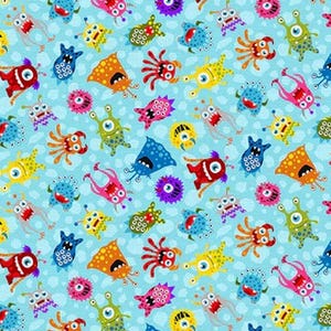 May include: A light blue fabric with a repeating pattern of colorful cartoon monsters. The monsters are in various shapes and colors, including red, yellow, blue, orange, and pink, with multiple eyes and tentacles.