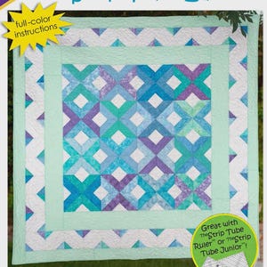 May include: A quilt pattern titled "Strip Tube Lattice" by Cozy Quilt Designs. The quilt features a geometric design with blue, teal, and purple diamond shapes. The pattern includes full-color instructions and is designed for 2 1/2" strips. Lap, Throw, Twin, Queen, and King sizes are included.