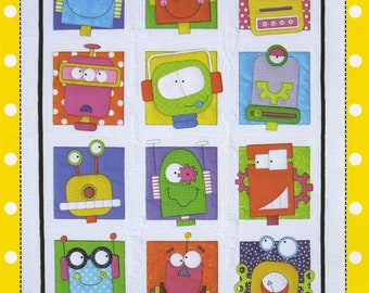 Robots # ABD272 From Amy Bradley Designs-60-1/2in x 96-1/2in Twin quilt version, and 13-1/2in x 41in Pocket organizer.