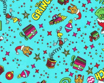May include: A light blue fabric featuring a repeating pattern of The Grinch, Max the dog wearing a Santa hat, jack-in-the-boxes, colorful gift boxes, Christmas ornaments, and yellow stars, interspersed with small red dots and pink four-pointed stars.