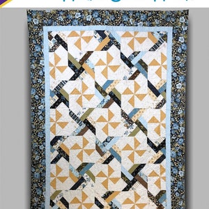 May include: A quilt pattern titled "Head Over Heels" by Cozy Quilt Designs. The quilt features a geometric design with pinwheel-like shapes in shades of tan, blue, and brown. The border is a floral print. The pattern is for 2 1/2" strips.