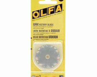 May include: An OLFA 45 mm wave rotary blade in yellow packaging. The package features the text OLFA, Wave Rotary Blade, and includes a single circular blade with a wavy edge visible through a clear plastic blister pack on the front.