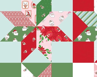 May include: A quilt fabric pattern featuring a star design composed of various holiday-themed prints in red, green, pink, and light blue. The fabric displays illustrations of Santa Claus, Mrs. Claus, reindeer, poinsettias, and candy canes.