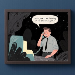 May include: A framed illustration depicting a man on the phone, looking stressed. A speech bubble above him reads, "Have you tried turning it off and on again?" The background is dark, with a computer and foliage. The man wears a shirt and tie.