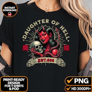 May include: A black t-shirt featuring a graphic of a red-skinned devil figure with horns and a tail, holding a human skull. The text reads DAUGHTER OF HELL and EST. 666, accompanied by Japanese characters and skeletal hands framing the bottom text.