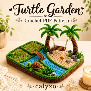 May include: A crochet display featuring a brown turtle on a green base with a blue stream, a brown bridge, and a sandy beach area with two palm trees and a hanging swing. The text reads Turtle Garden Crochet PDF Pattern and calyxo.