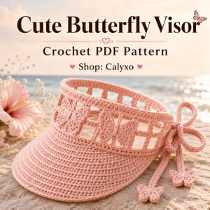 May include: A light pink crochet visor featuring a grid pattern with integrated butterfly motifs. The visor has a wide brim and side ties that end in small crochet butterfly charms. The text reads: Cute Butterfly Visor Crochet PDF Pattern Shop: Calyxo.
