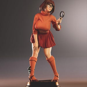 May include: A figurine of a character wearing a burnt orange turtleneck sweater, matching pleated skirt, and knee-high socks. She wears black glasses and holds a magnifying glass. The figure stands on a dark base with a gold trim.