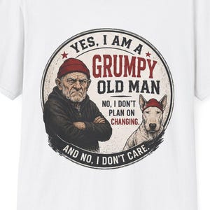 May include: White t-shirt featuring a circular graphic with the text "YES, I AM A GRUMPY OLD MAN" and an illustration of an older man and a dog. The shirt has a crew neck and short sleeves.